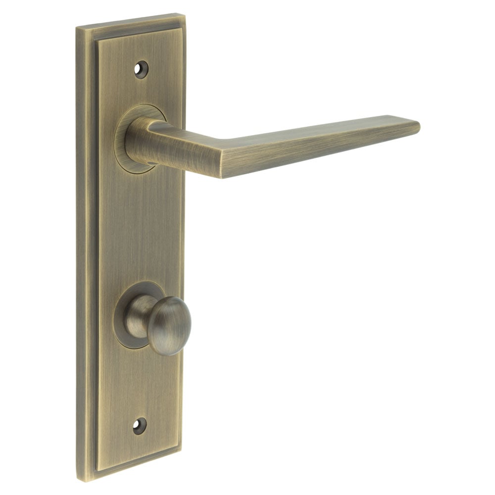 This is an image showing the Frelan - Mayfair Door Handle Din Bathroom Backplate Antique Brass & Turn & Release available to order from Trade Door Handles in Kendal