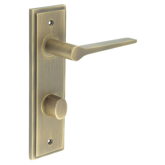 This is an image showing the Frelan - Knightsbridge Door Handle Din Bathroom Backplate Antique Brass & Turn & Release available to order from Trade Door Handles in Kendal