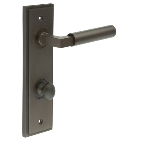 This is an image showing the Frelan - Westminster Door Handle Din Bathroom Backplate Dark Bronze & Turn & Release available to order from Trade Door Handles in Kendal