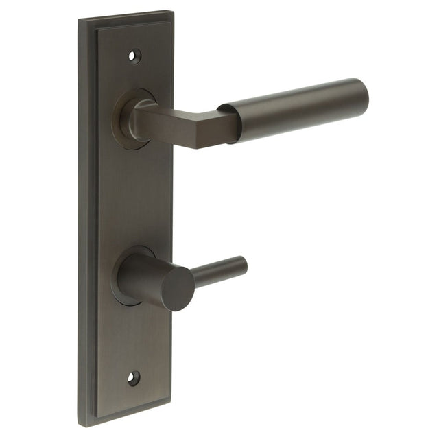 This is an image showing the Frelan - Westminster Door Handle Din Bathroom Backplate Dark Bronze & Turn & Release available to order from Trade Door Handles in Kendal