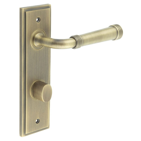 This is an image showing the Frelan - Highgate Door Handle Din Bathroom Backplate Antique Brass & Turn & Release available to order from Trade Door Handles in Kendal