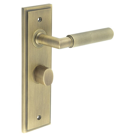 This is an image showing the Frelan - Piccadilly Door Handle Bathroom Backplate Antique Brass & Turn & Release available to order from Trade Door Handles in Kendal