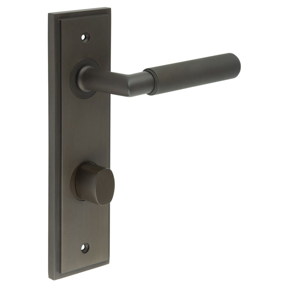 This is an image showing the Frelan - Piccadilly Door Handle Din Bathroom Backplate Dark Bronze & Turn & Release available to order from Trade Door Handles in Kendal