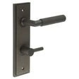 This is an image showing the Frelan - Piccadilly Door Handle Din Bathroom Backplate Dark Bronze & Turn & Release available to order from Trade Door Handles in Kendal