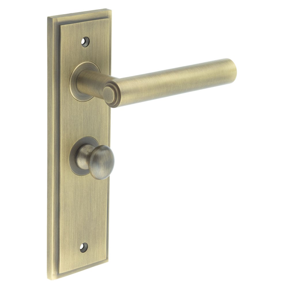 This is an image showing the Frelan - Richmond Door Handle Bathroom Backplate Antique Brass & Turn & Release available to order from Trade Door Handles in Kendal