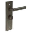 This is an image showing the Frelan - Richmond Door Handle Bathroom Backplate Dark Bronze & Turn & Release available to order from Trade Door Handles in Kendal