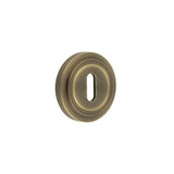 High quality image of Burlington - Standard Keyway Escutcheons Stepped Rose Antique Brass Sku. BUR-60AB-73AB