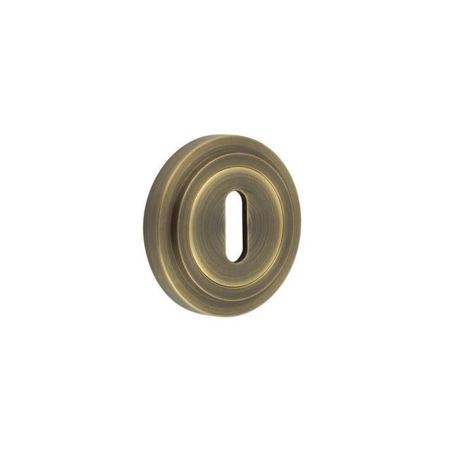 High quality image of Burlington - Standard Keyway Escutcheons Stepped Rose Antique Brass Sku. BUR-60AB-73AB