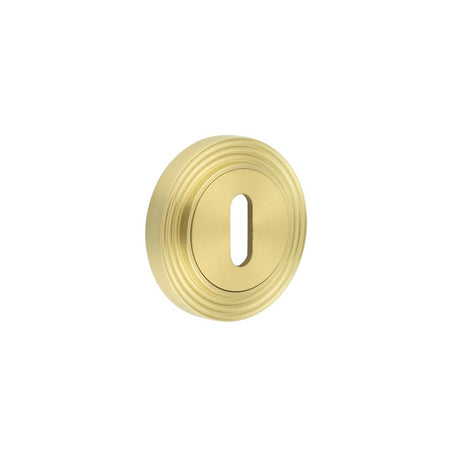 This is an image showing the Frelan - Burlington Standard Keyway Escutcheons Reeded Rose Satin Brass available to order from Trade Door Handles in Kendal