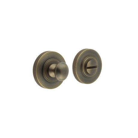 This is an image showing the Frelan - Burlington Turns & Releases Inner 1 Knurled Rose Antique Brass available to order from Trade Door Handles in Kendal