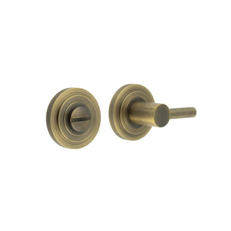 This is an image showing the Frelan - Burlington Easy Turn & Release Stepped Rose Antique Brass available to order from Trade Door Handles in Kendal