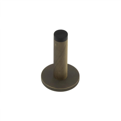 This is an image showing the Frelan - Burlington Knurled Wall Mounted Doorstops Knurled Rose Antique Brass available to order from Trade Door Handles in Kendal