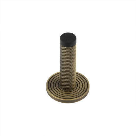 High quality image of Burlington - Knurled Wall Mounted Doorstops Reeded Rose Antique Brass Sku. BUR-968AB-974AB