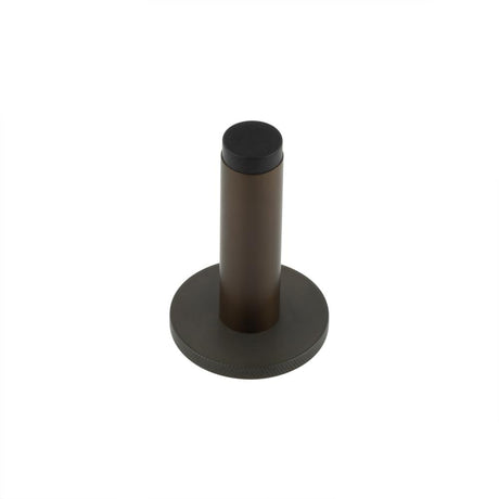 This is an image showing the Frelan - Burlington Plain Wall Mounted Door Stops Knurled Rose Dark Bronze available to order from Trade Door Handles in Kendal