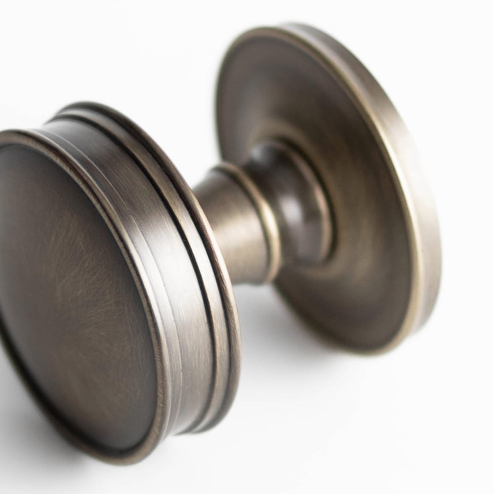 This is an image showing the Burlington - Berkeley Mortice knob - Antique Brass available to order from Trade Door Handles in Kendal