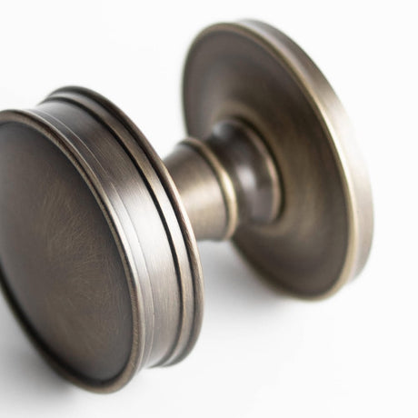 This is an image showing the Burlington - Berkeley Mortice knob - Antique Brass available to order from Trade Door Handles in Kendal