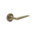 This is an image showing the Frelan - Mayfair Door Handle on Knurled Rose Antique Brass available to order from Trade Door Handles in Kendal