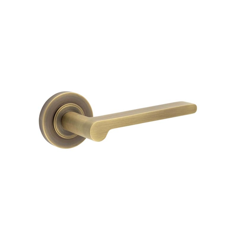 This is an image showing the Frelan - Fitzrovia Door Handles Plain Rose Antique Brass available to order from Trade Door Handles in Kendal