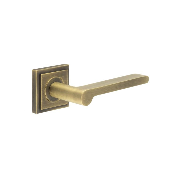 This is an image showing the Frelan - Fitzrovia Door Handles Square Stepped Rose Antique Brass available to order from Trade Door Handles in Kendal