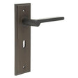 This is an image showing the Frelan - Fitzrovia Door Handle Lock Backplate Dark Bronze available to order from Trade Door Handles in Kendal