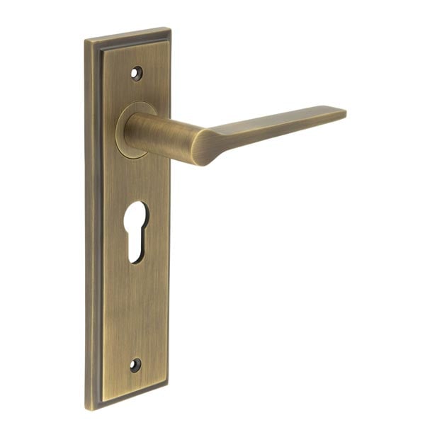 This is an image showing the Frelan - Knightbridge Door Handle Euro Backplate Antique Brass available to order from Trade Door Handles in Kendal