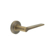 This is an image showing the Frelan - Knightsbridge Door Handle on Chamfered Rose Antique Brass available to order from Trade Door Handles in Kendal