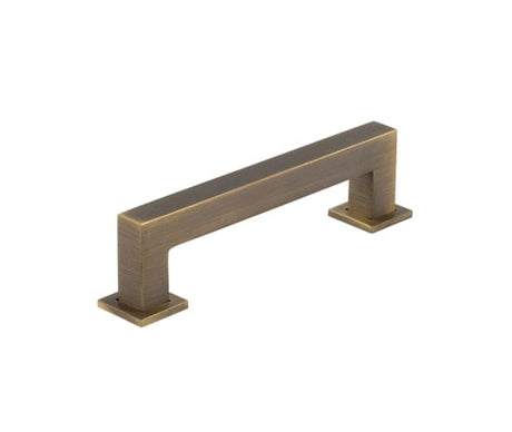 This is an image showing the Burlington - Trafalgar Cabinet Handle 128mm CTC - Antique Brass available to order from Trade Door Handles in Kendal