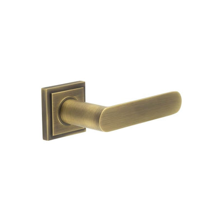 This is an image showing the Frelan - Kensington Door Handles Square Stepped Rose Antique Brass available to order from Trade Door Handles in Kendal