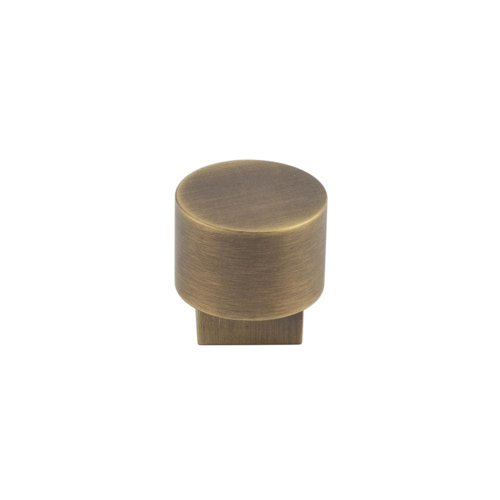 This is an image showing the Burlington - Westminster Cupboard knob - Antique Brass available to order from Trade Door Handles in Kendal