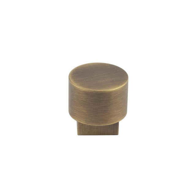 This is an image showing the Burlington - Westminster Cupboard knob - Antique Brass available to order from Trade Door Handles in Kendal