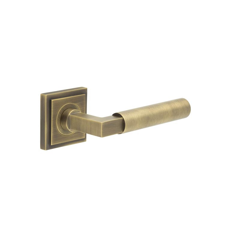High quality image of Burlington - Westminster Door Handle on Square Stepped Rose Antique Brass Sku. BUR30KIT7