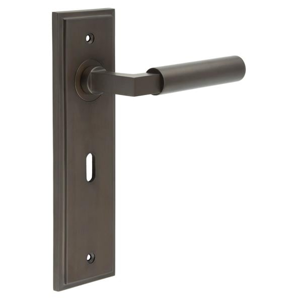 This is an image showing the Frelan - Westminster Door Handle Lock Backplate Dark Bronze available to order from Trade Door Handles in Kendal