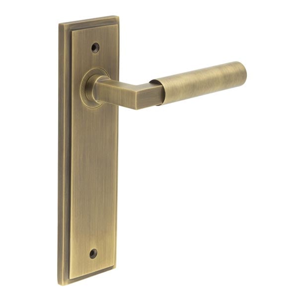 This is an image showing the Frelan - Westminster Door Handle Latch Backplate Antique Brass available to order from Trade Door Handles in Kendal