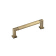 This is an image showing the Burlington - Westminster Cabinet Handle 128mm CTC - Antique Brass available to order from Trade Door Handles in Kendal