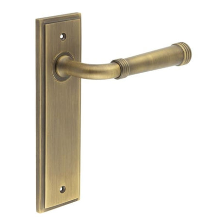 This is an image showing the Frelan - Highgate Door Handle Latch Backplate Antique Brass available to order from Trade Door Handles in Kendal