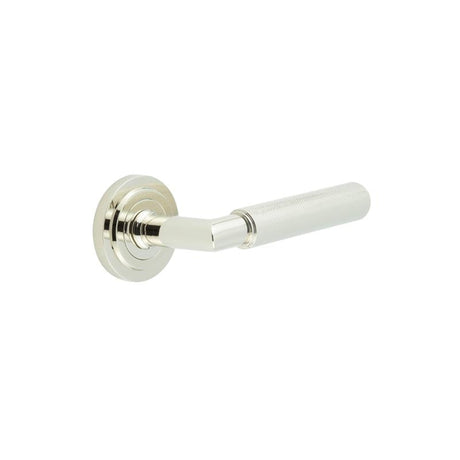 This is an image showing the Frelan - Piccadilly Door Handle on Stepped Rose Polished Nickel available to order from Trade Door Handles in Kendal