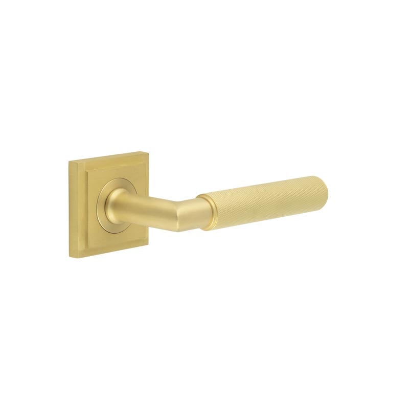 This is an image showing the Frelan - Piccadilly Door Handle on Square Stepped Rose Satin Brass available to order from Trade Door Handles in Kendal