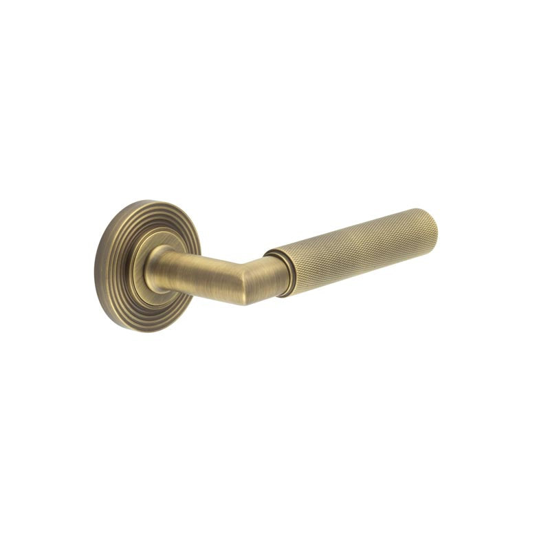 High quality image of Burlington - Piccadilly Door Handle on Reeded Rose Antique Brass Sku. BUR40KIT4