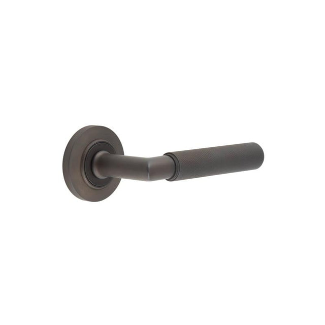 This is an image showing the Frelan - Piccadilly Door Handle on Chamfered Rose Dark Bronze available to order from Trade Door Handles in Kendal