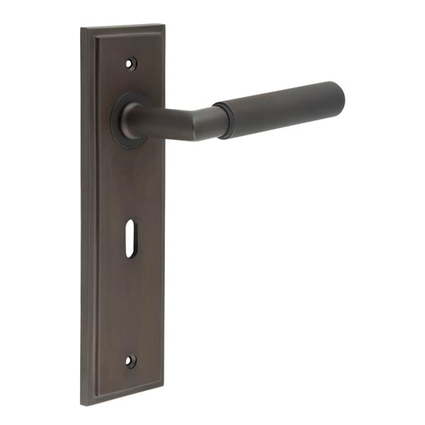 This is an image showing the Frelan - Piccadilly Door Handle Lock Backplate Dark Bronze available to order from Trade Door Handles in Kendal