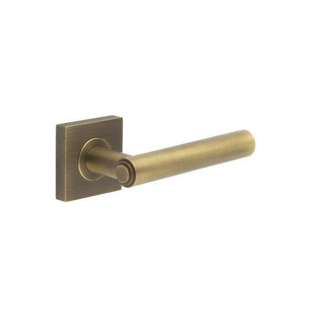 This is an image showing the Frelan - Richmond Door Handles Square Plain Antique Brass available to order from Trade Door Handles in Kendal