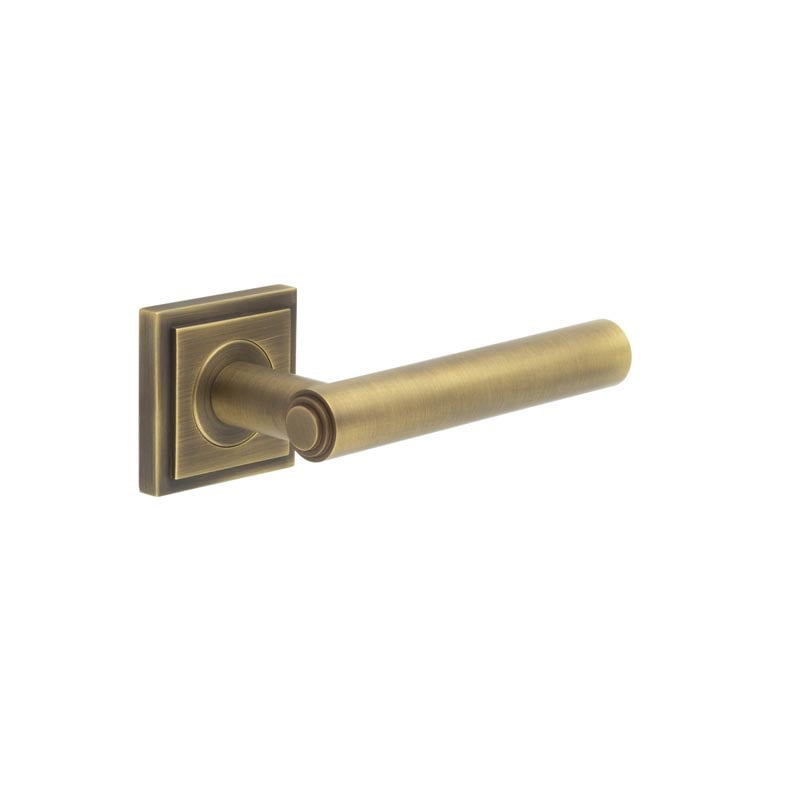 This is an image showing the Frelan - Richmond Door Handles Square Stepped Antique Brass available to order from Trade Door Handles in Kendal