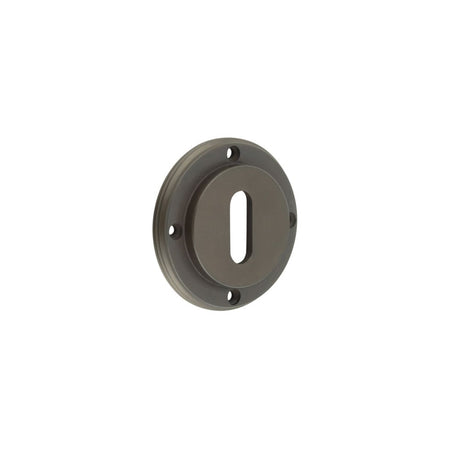 This is an image showing the Burlington - inner escutcheon std keyway - Dark Bronze available to order from Trade Door Handles in Kendal