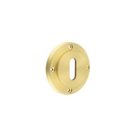 This is an image showing the Burlington - inner escutcheon std keyway - Satin Brass available to order from Trade Door Handles in Kendal