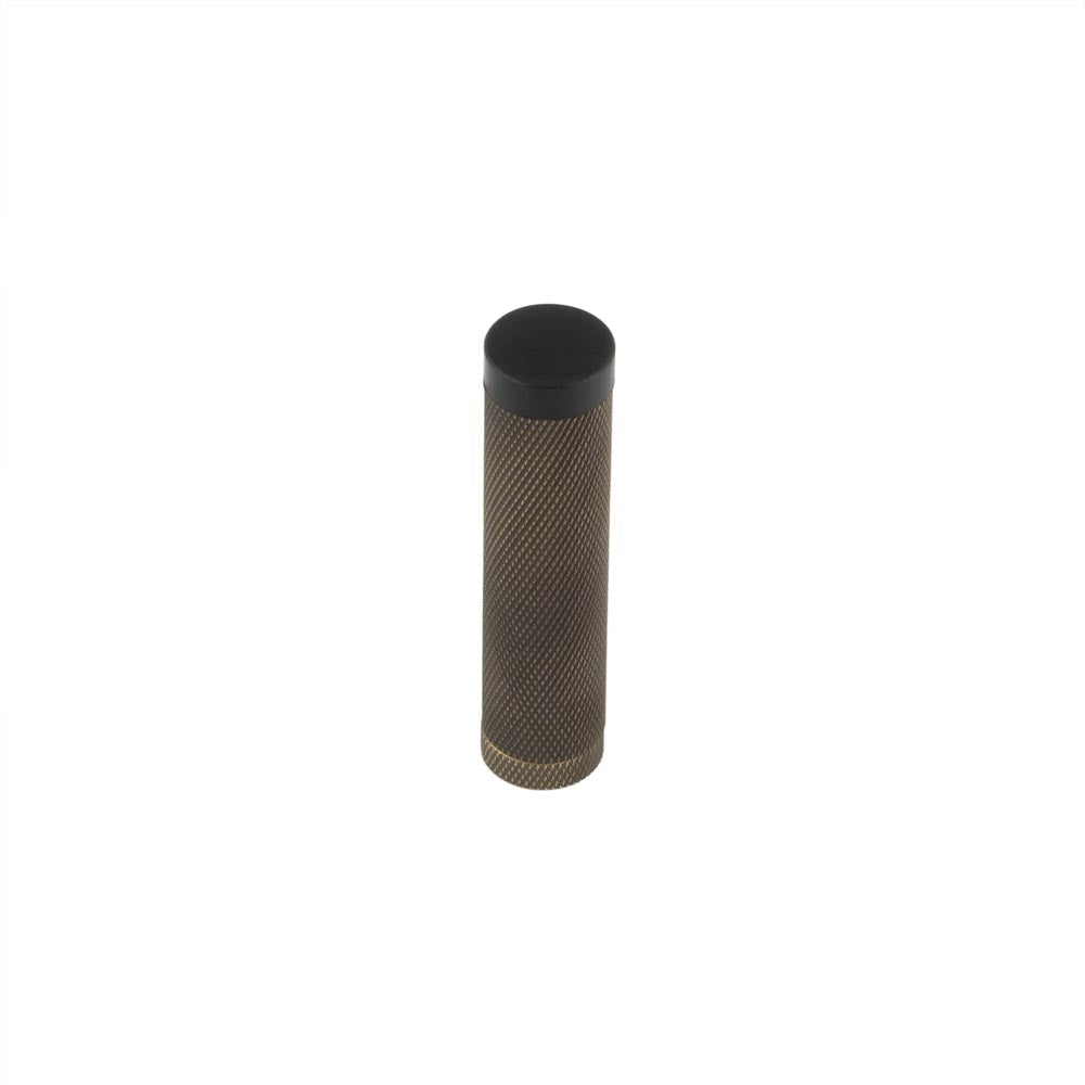 High quality image of Burlington - Knurled Wall Mounted Doorstops No Rose Antique Brass Sku. BUR968AB
