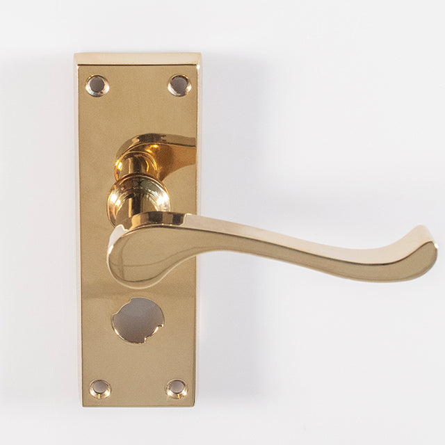 High quality image of Carlisle Brass - Contract Victorian Scroll Lever on Privacy Backplate - Polished Brass | Sku. cbs55wc | Trade Door Handles.