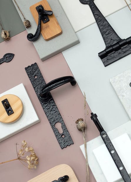 Image showing a range of Antique Black ironmongery by From The Anvil.  Available to order from Trade Door Handles in Kendal