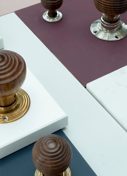 This is an image showing a range of From The Anvil Mortice Knobs and Cabinet knobs in Rosewood.  Available to order from Trade Door Handles in Kendal