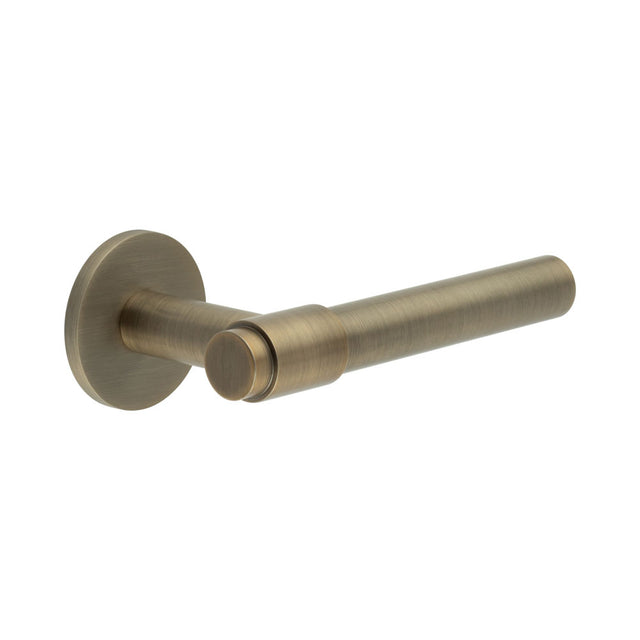High quality image of CRES - CR-103 Antique Brass Sprung Round Rose Door Handle Sku. CR-103A1AB