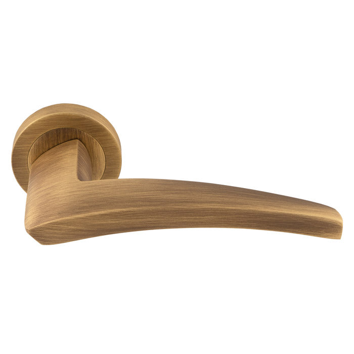 High quality image of Manital - Dune lever on Round Rose - Antique Brass | Sku. du5ab | Trade Door Handles.